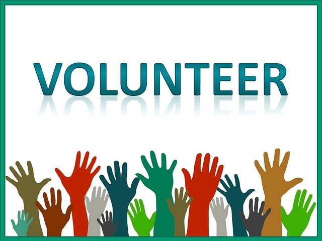 Volunteer logo with raised hands