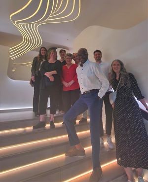 sponsor and MPI Toronto representatives standing on a staircase